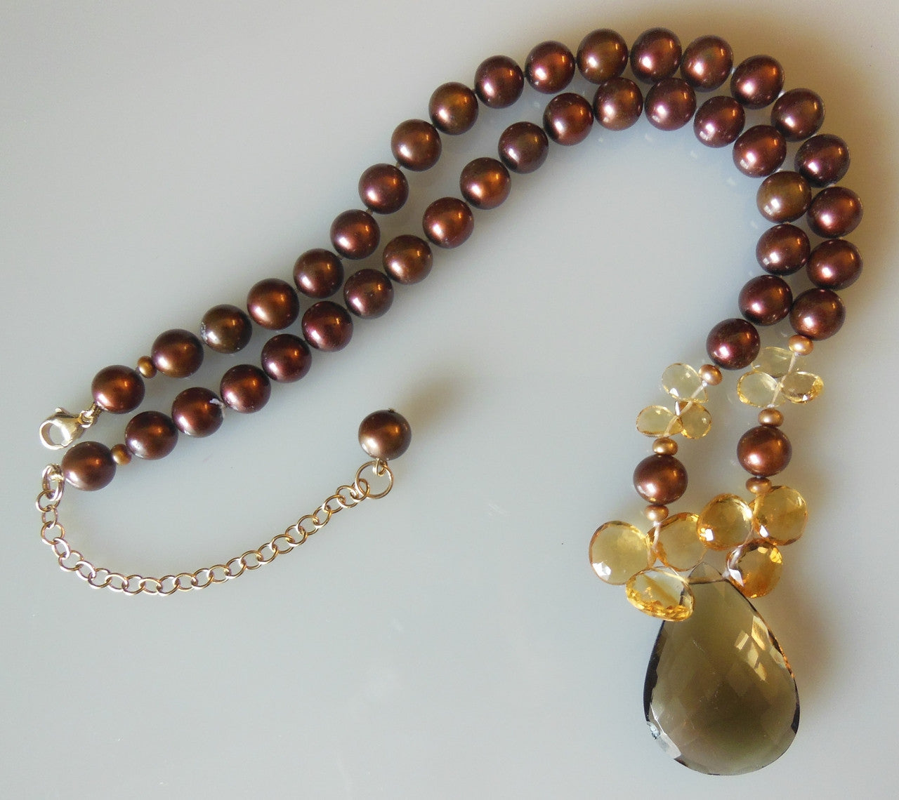 Smoky and citrine on chocolate pearls.